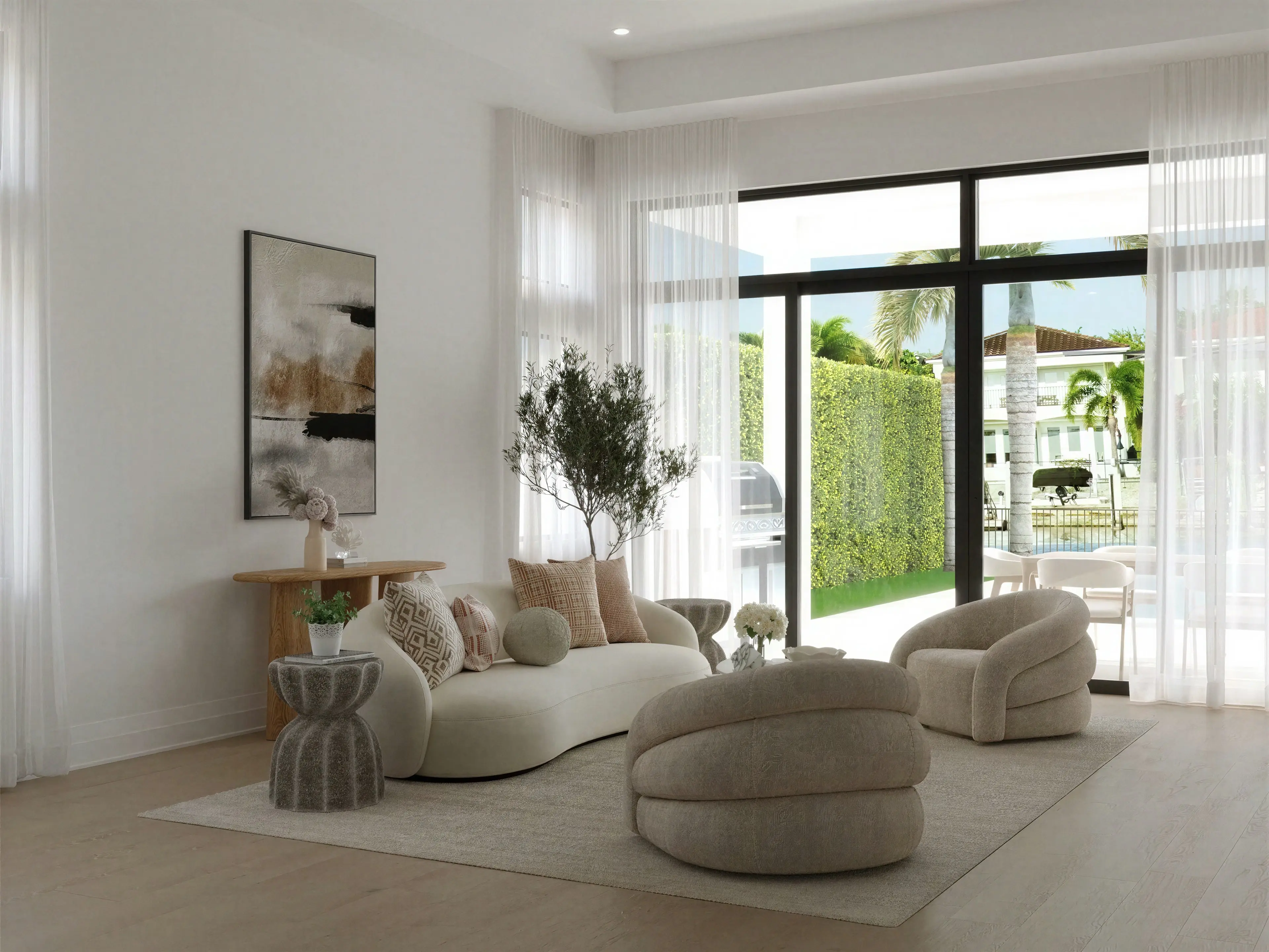 Sabal Palm Drive living room with cream curved seating and floor-to-ceiling windows