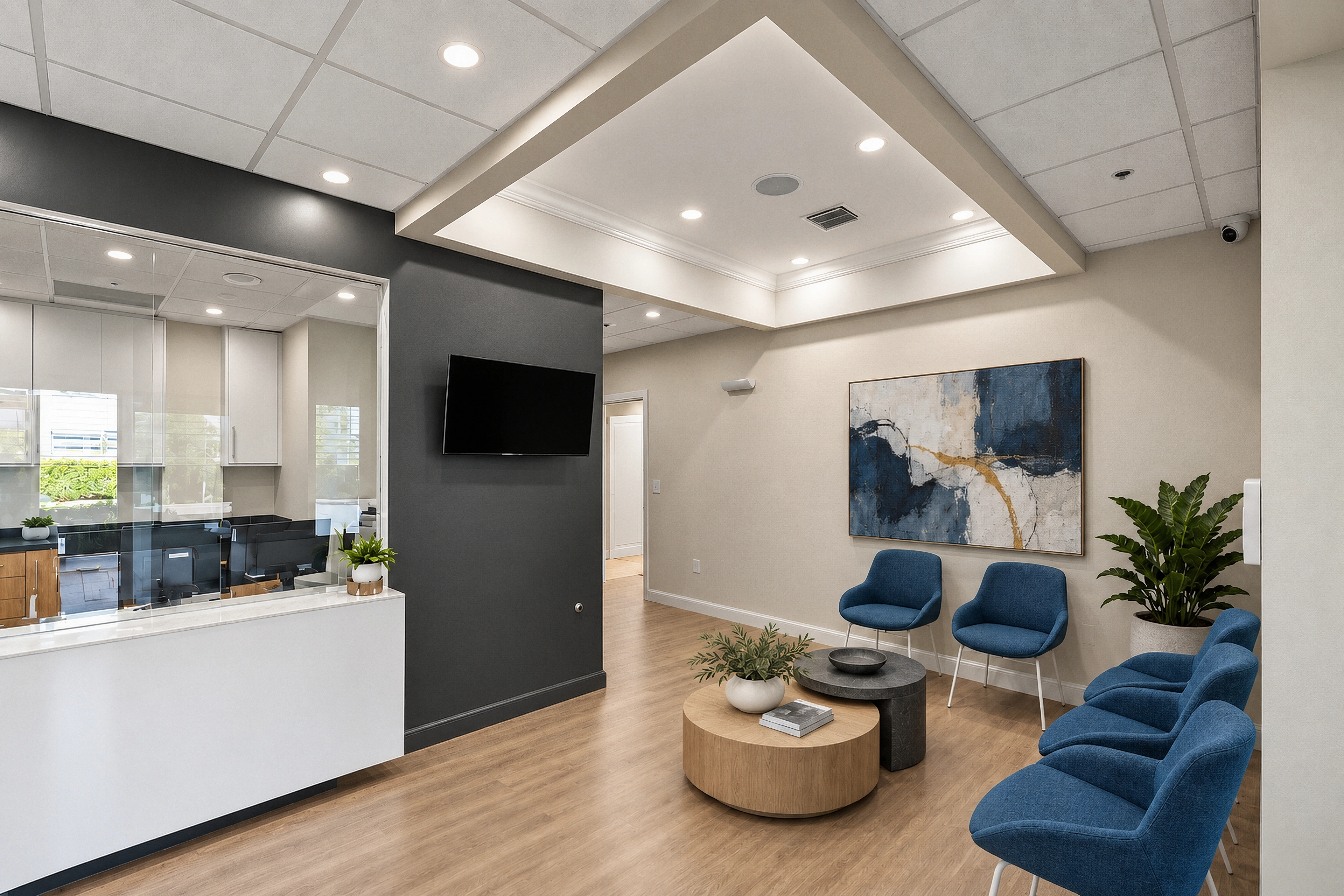 Bishop Health reception with blue seating, a textured abstract artwork and restrained greenery.