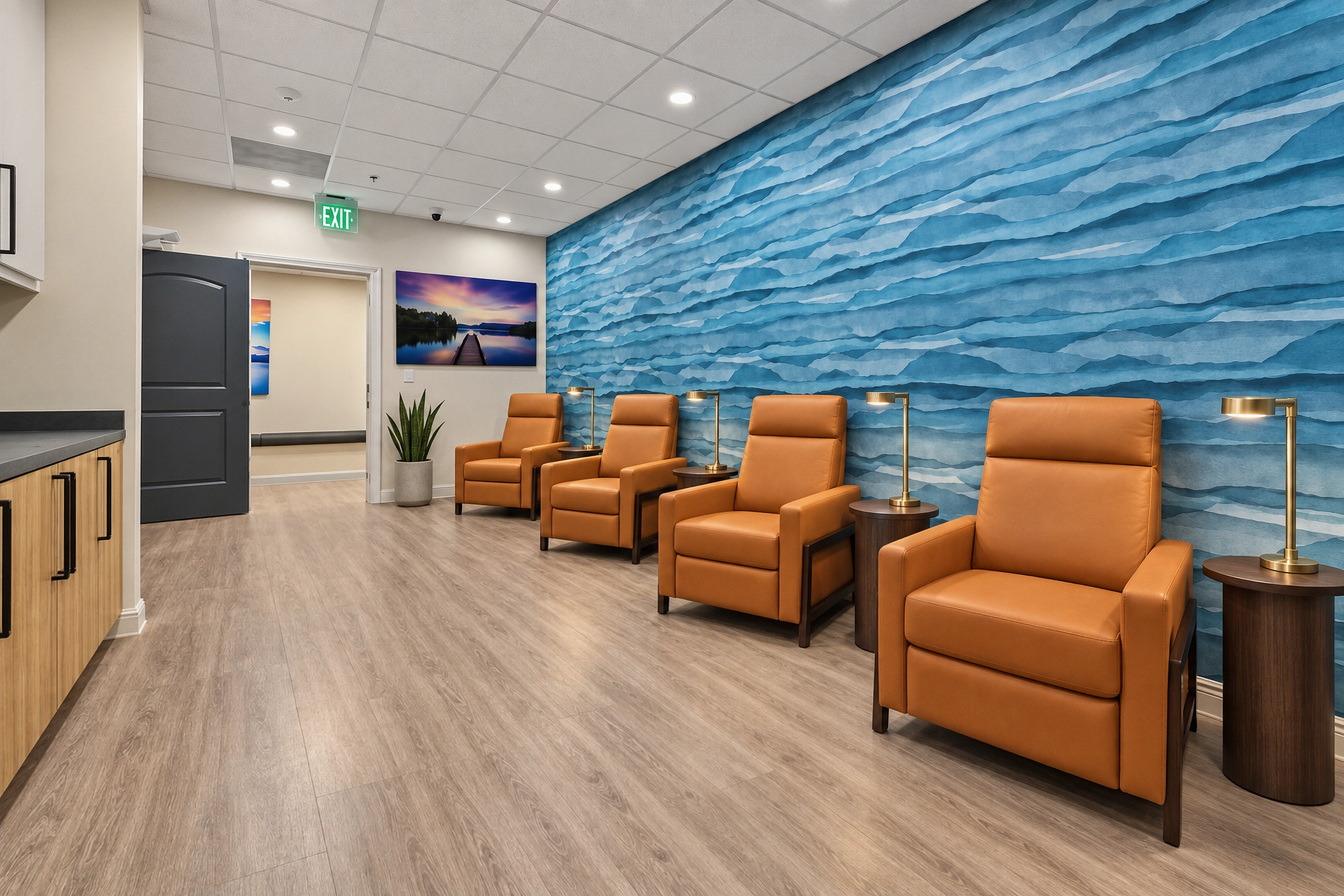 Cognac lounge seating, brass reading lights and the layered blue feature wall.