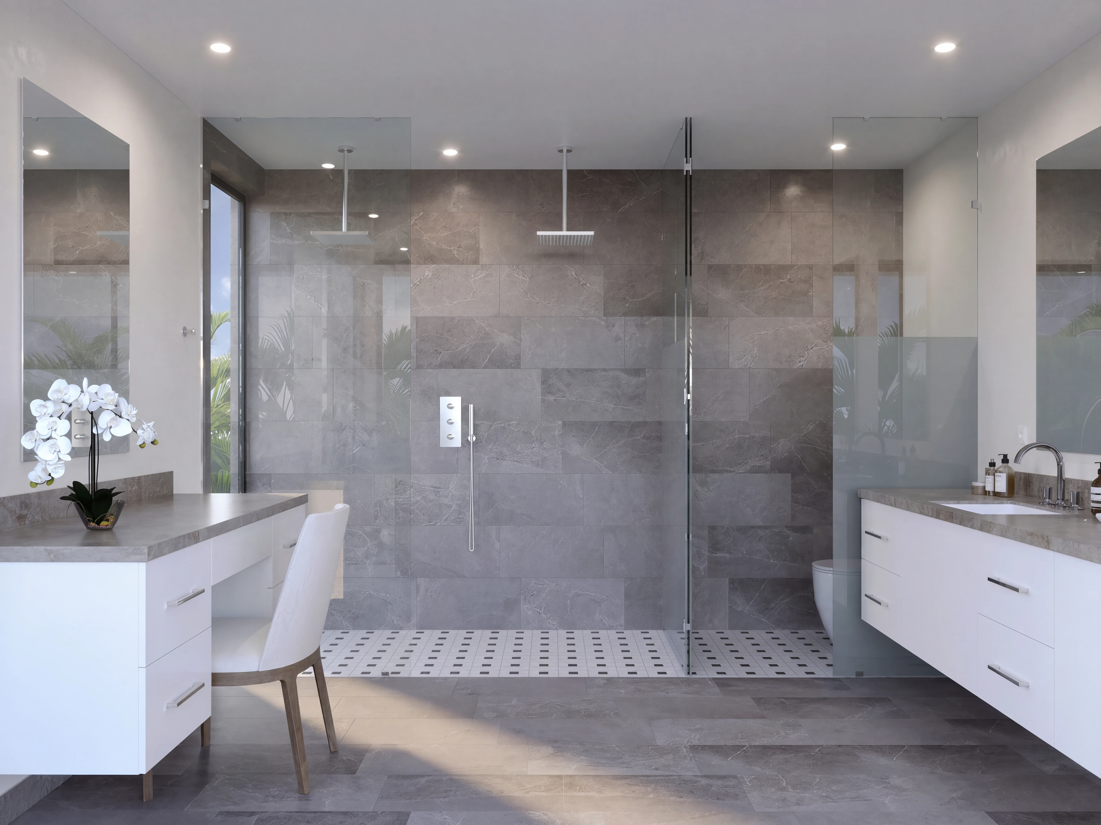 Bathroom with a glass shower and double vanity.