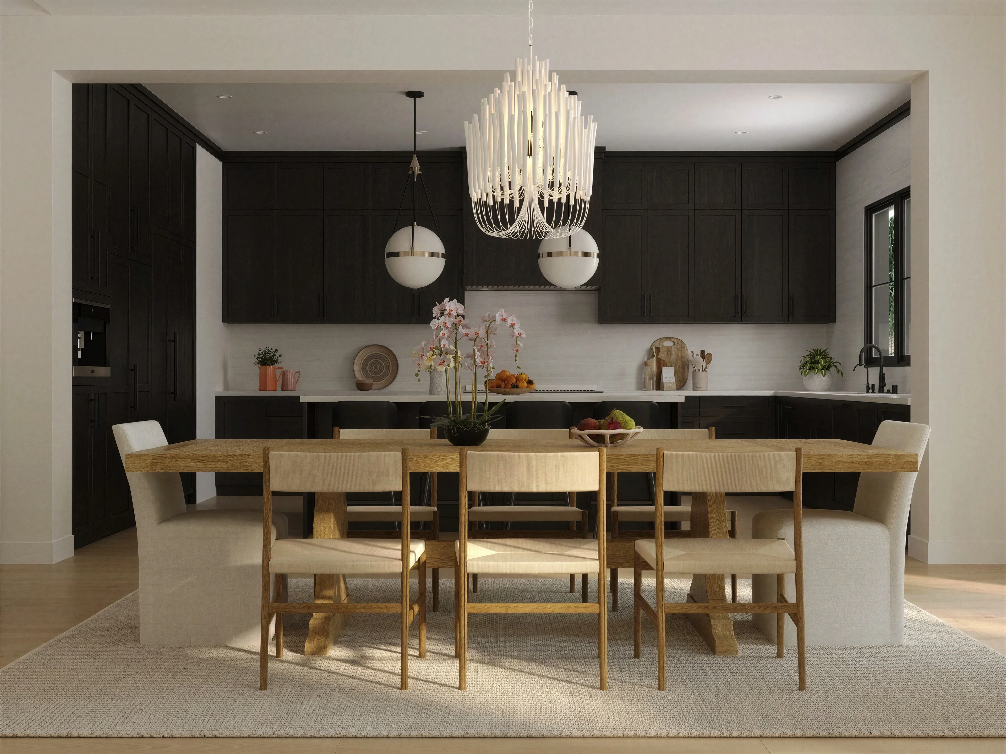 Dining table with woven chairs beside the kitchen.
