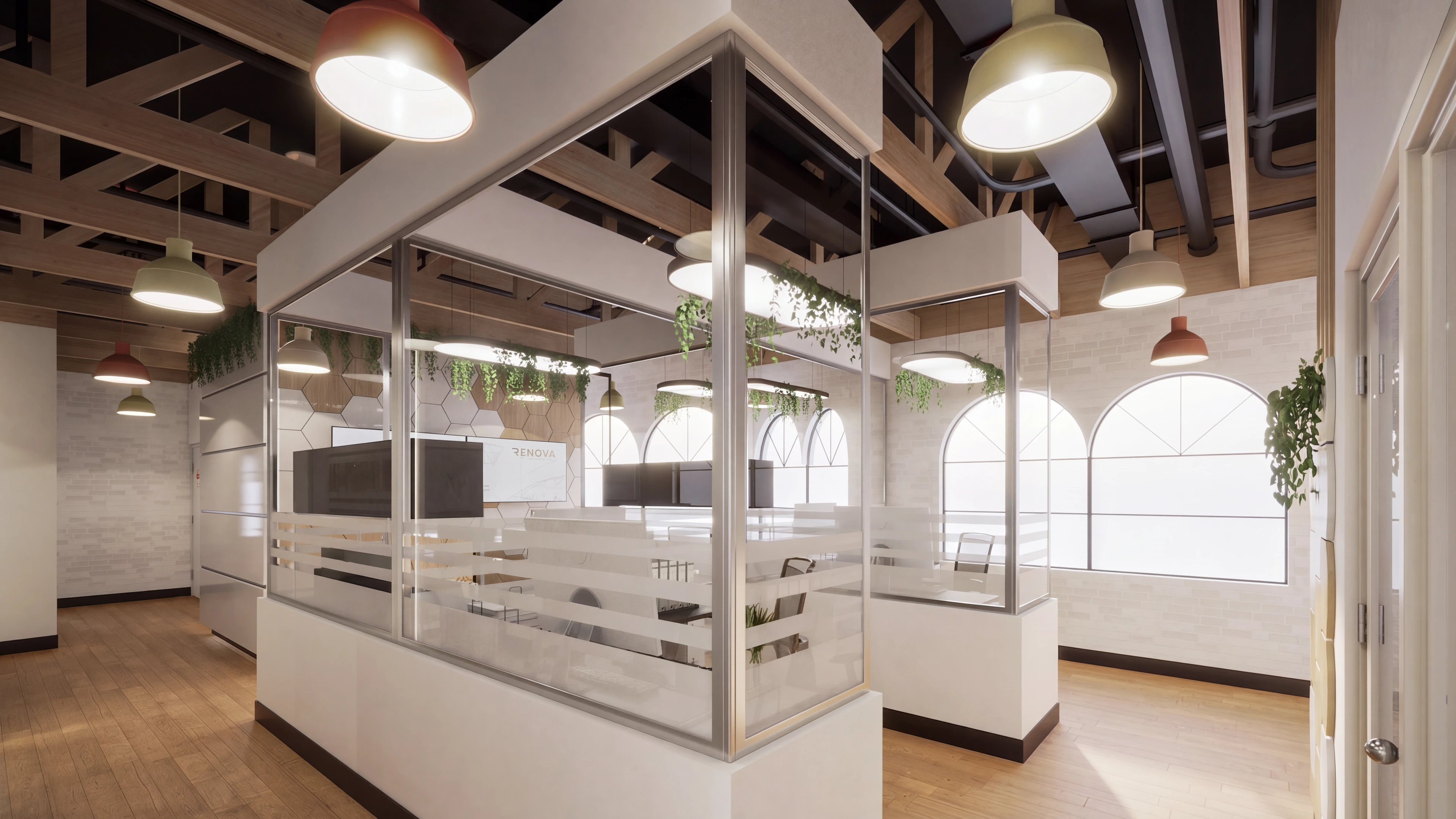 Open office with glass partitions beneath an exposed ceiling.