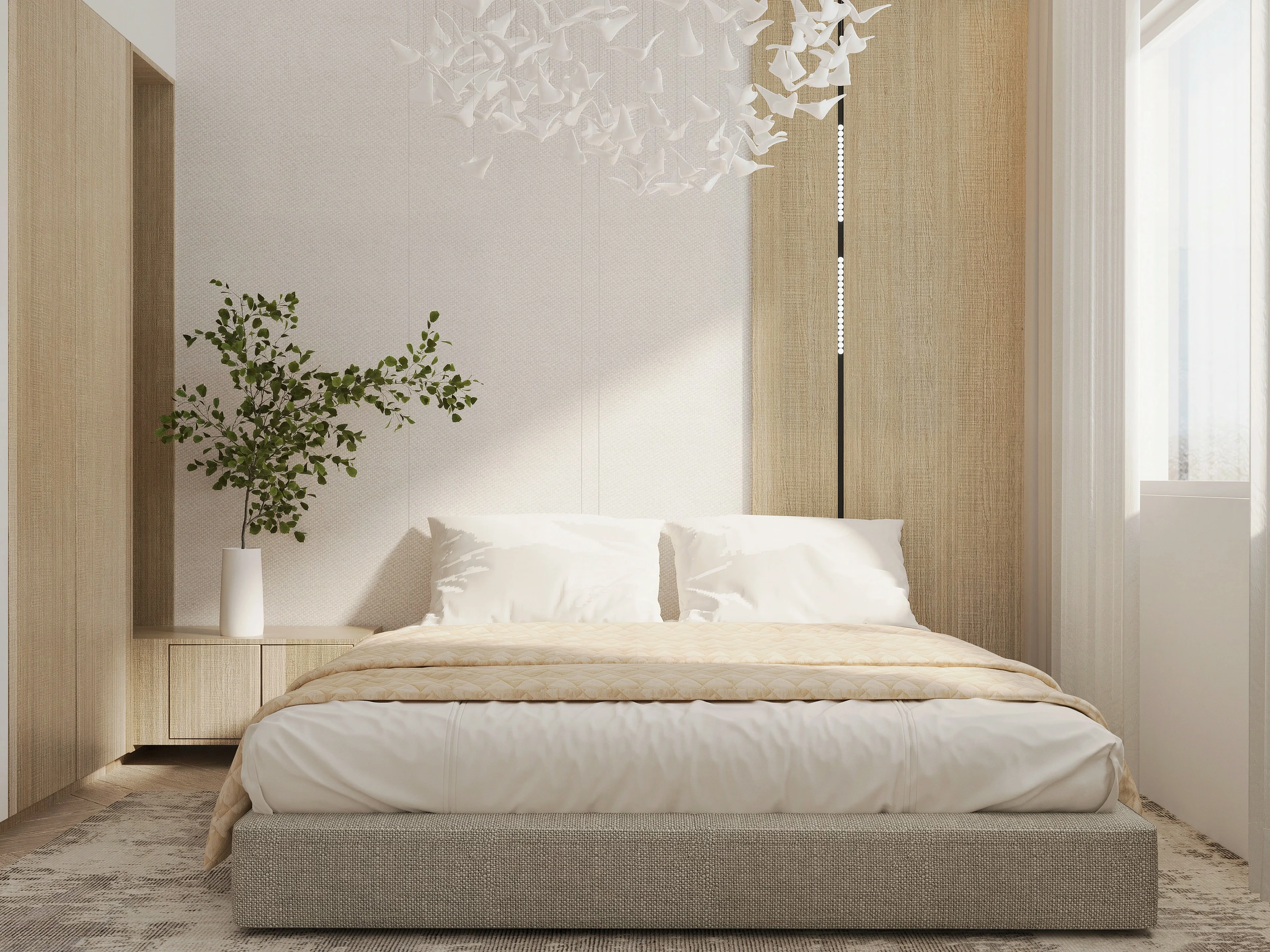 Bedroom with pale finishes and a decorative chandelier.