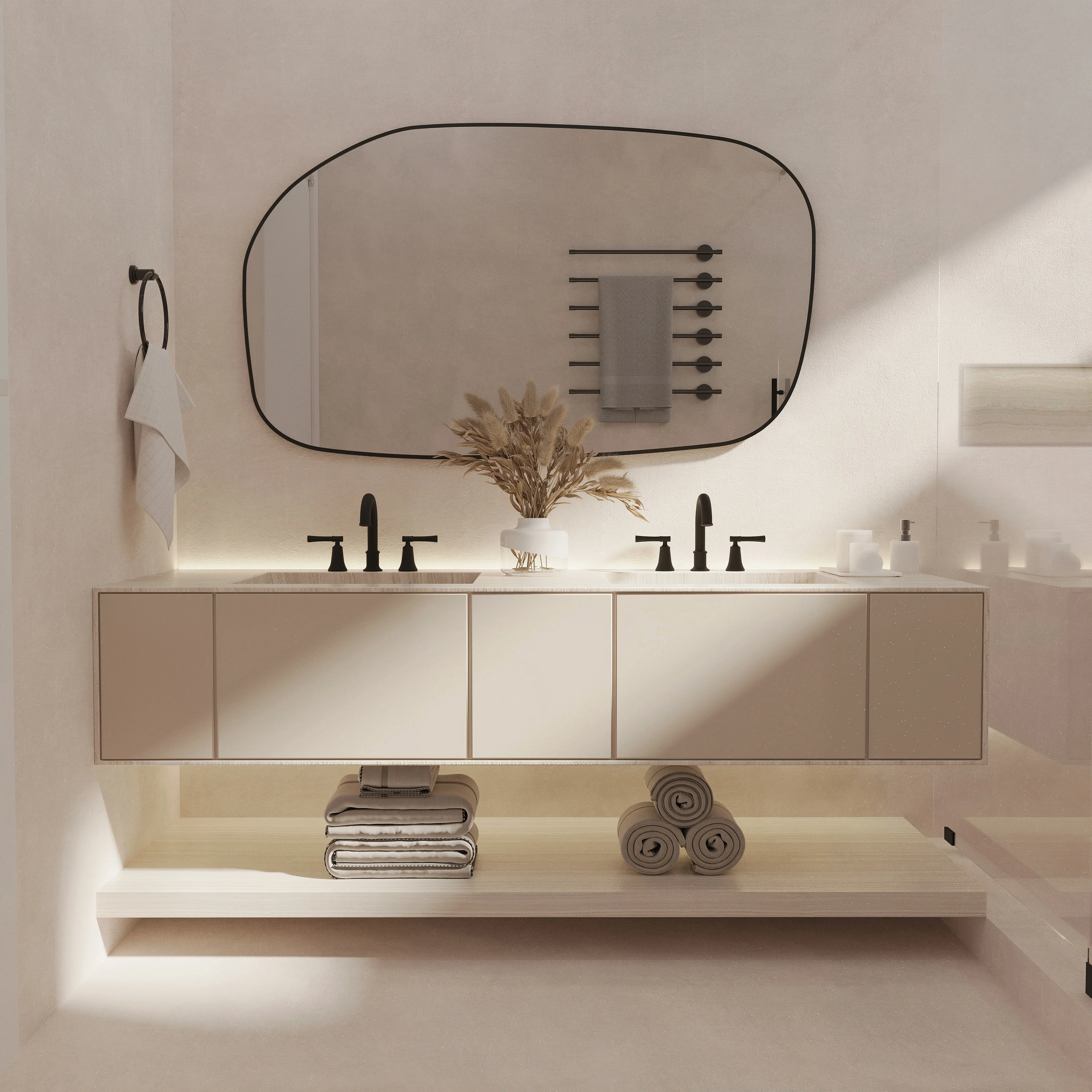 Bathroom vanity with an irregular oval mirror.