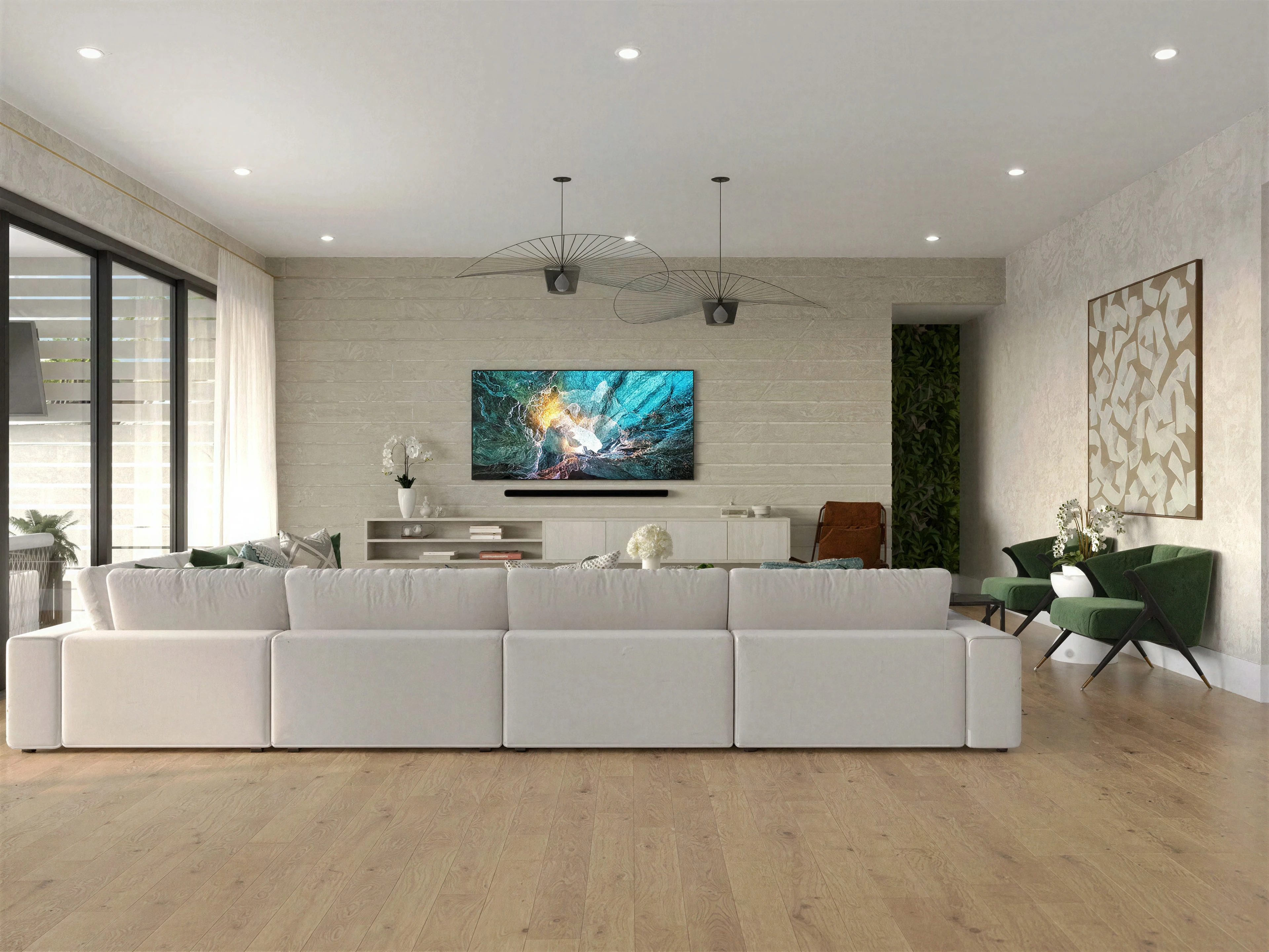 Living room with wide wood flooring and a white sectional.