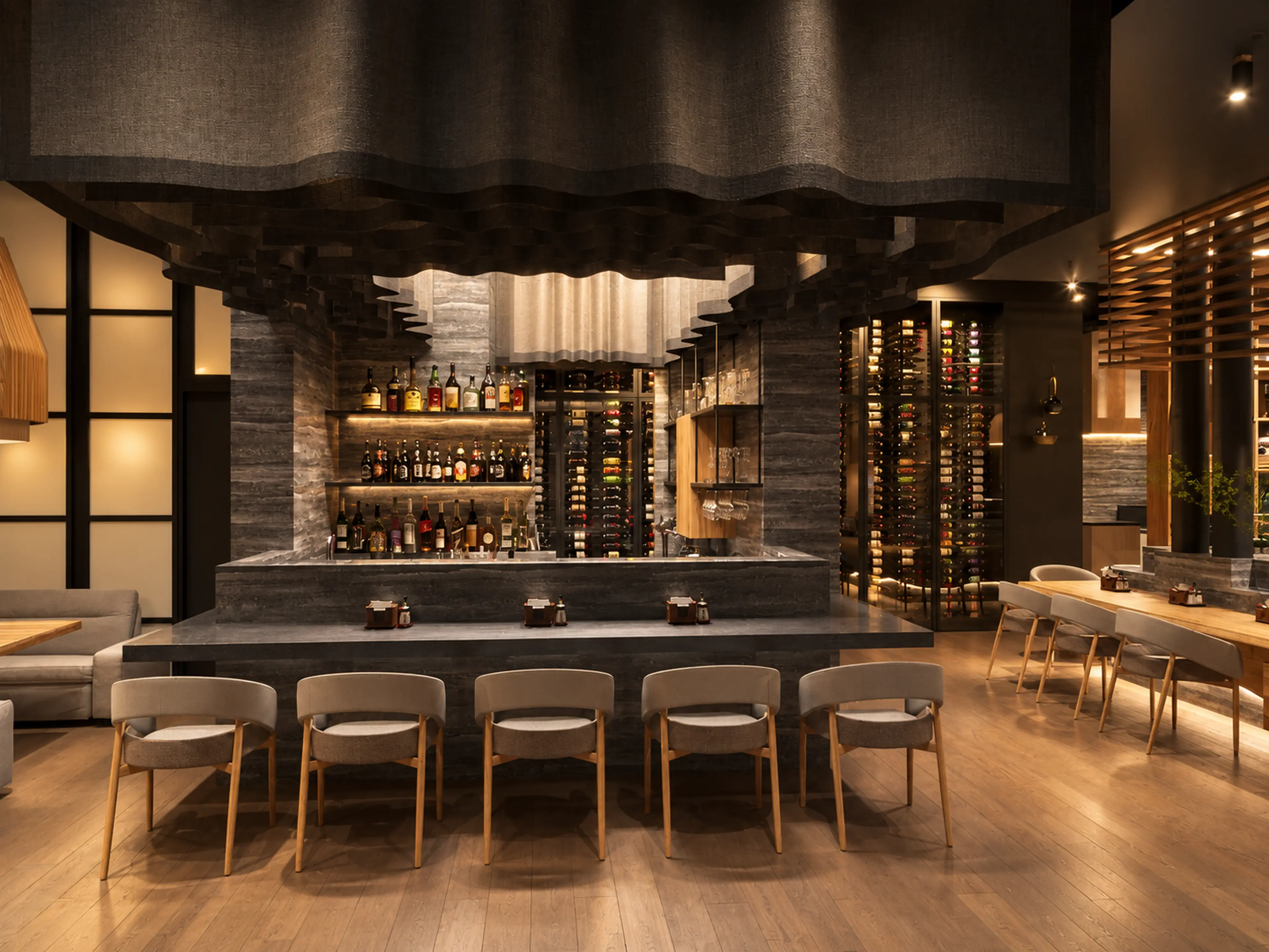 Photographic bar view with stone surfaces and a backlit bottle display.