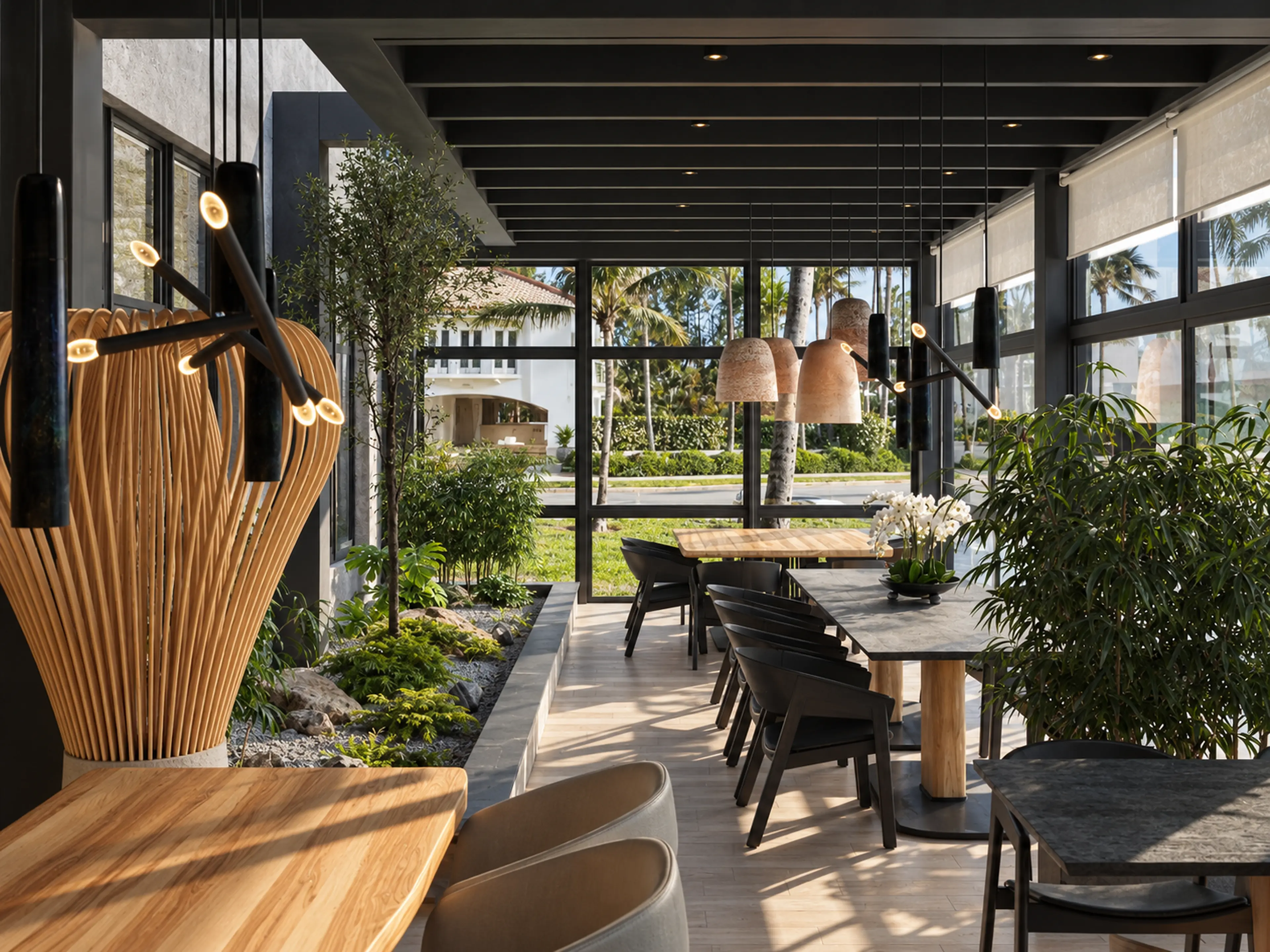 Photographic window-side dining view with sculptural wood lighting and indoor planting.