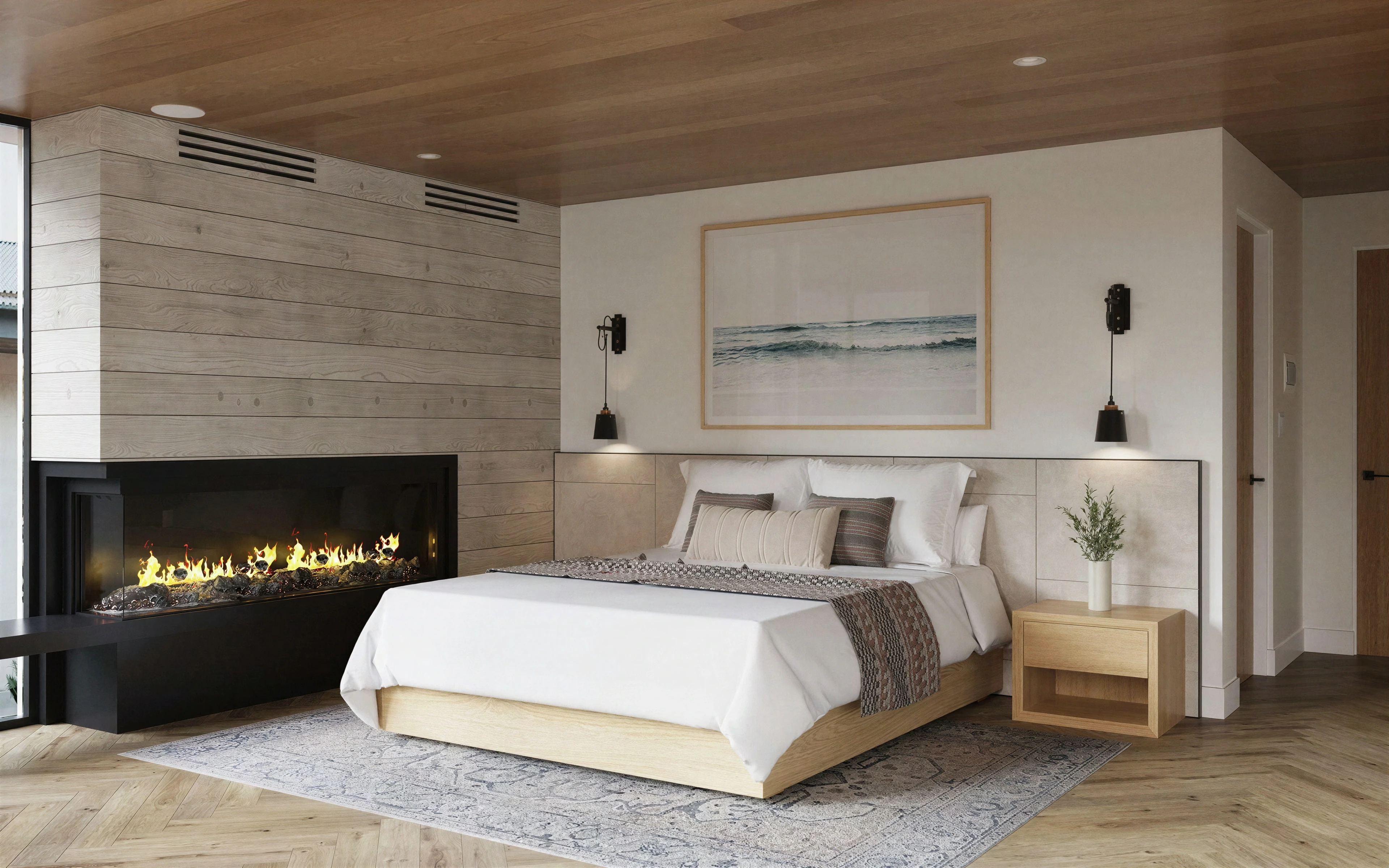 Bedroom with a wood ceiling and a fireplace beside the bed.