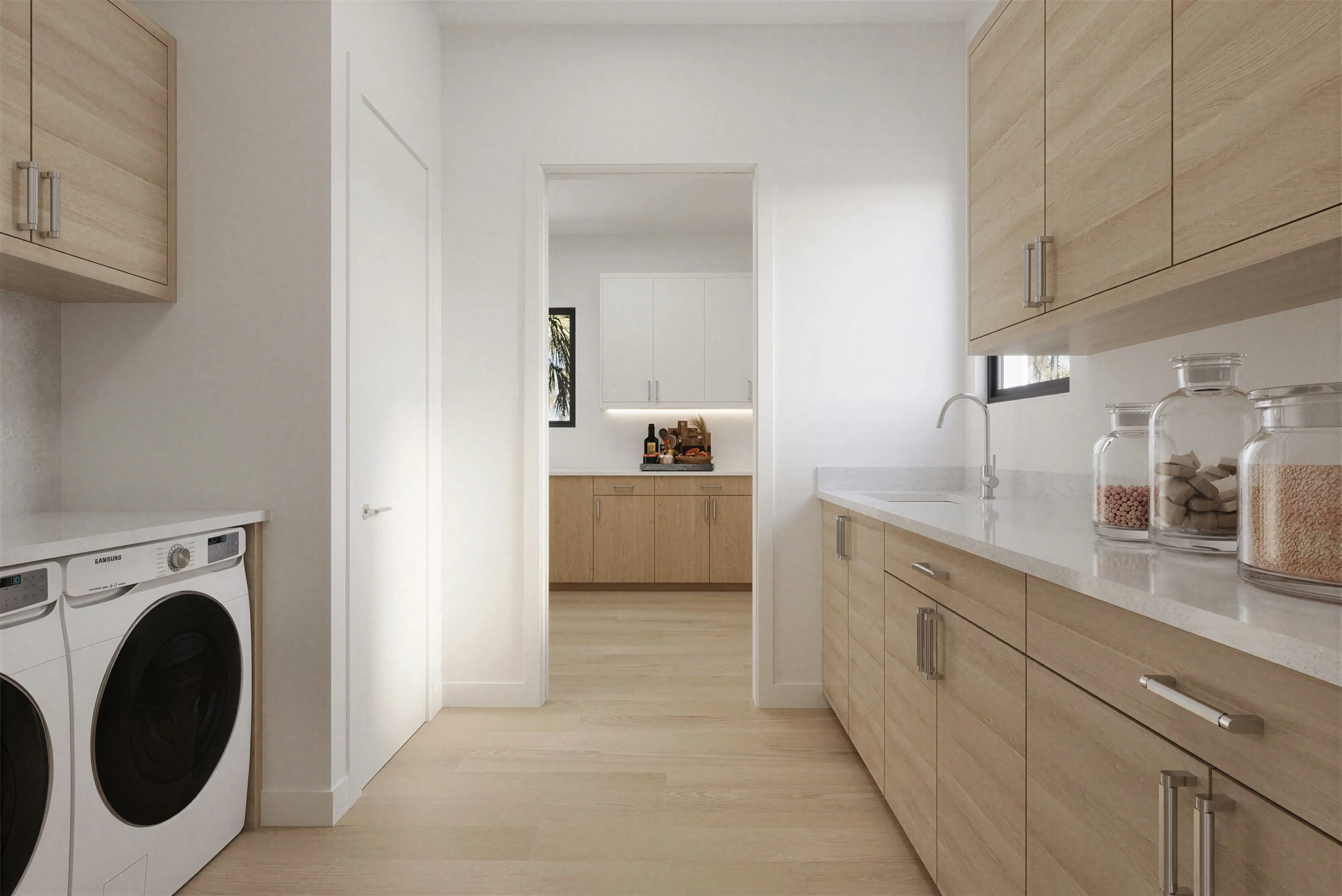 Laundry room with wood cabinetry and integrated appliances.