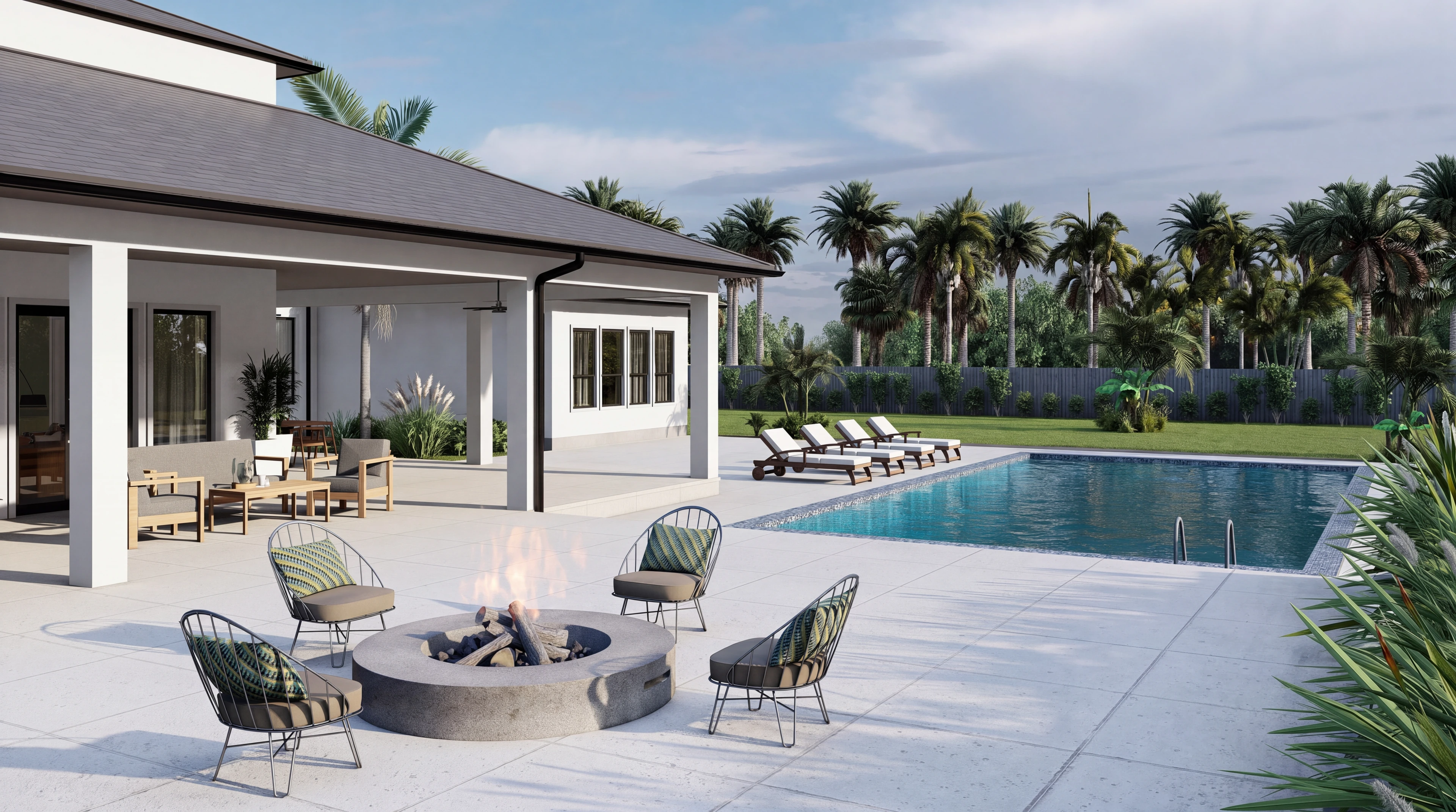 Outdoor lounge seating beside a fire pit and pool.