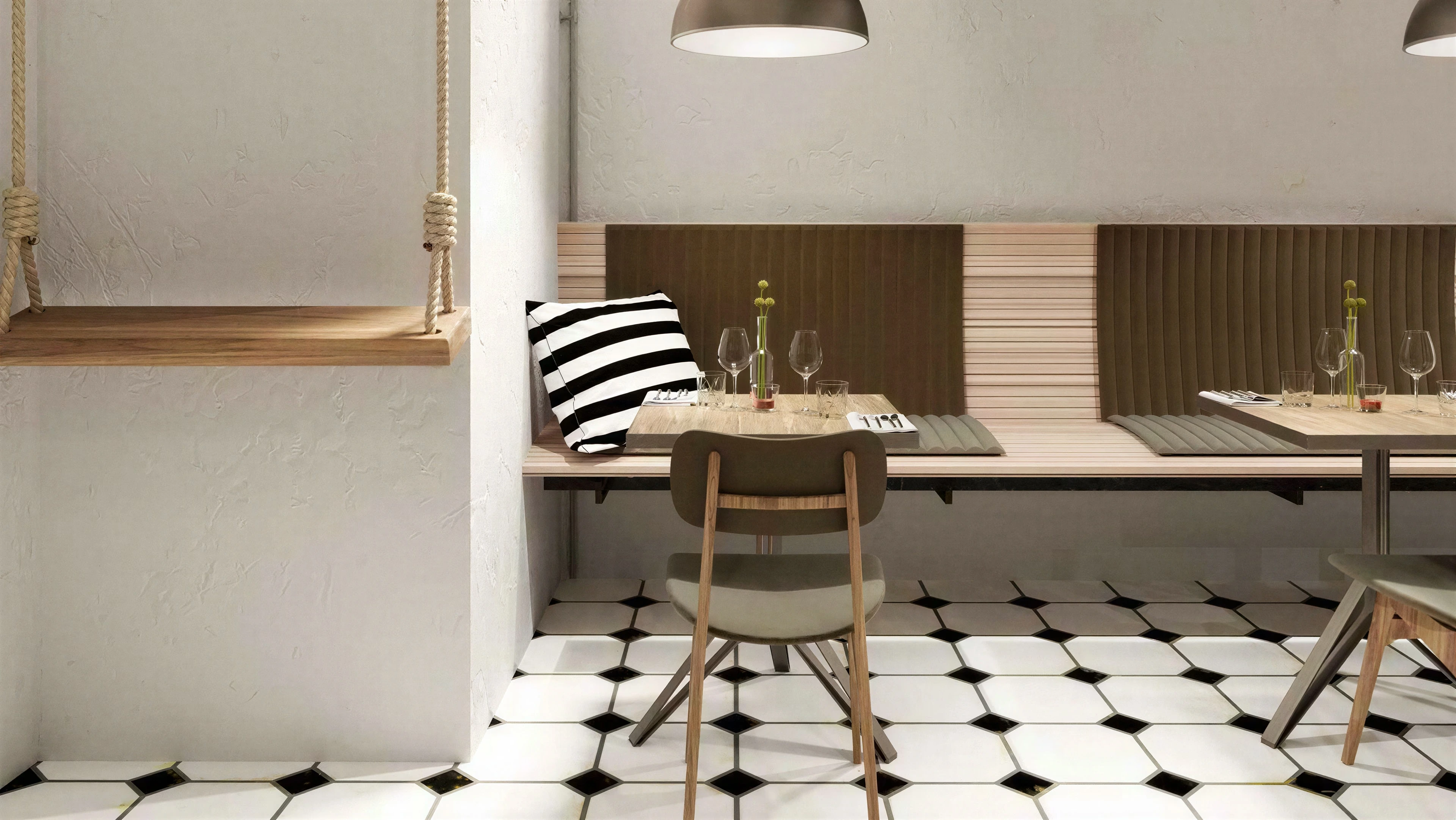 Restaurant booth seating beside a pale column and wall paneling.