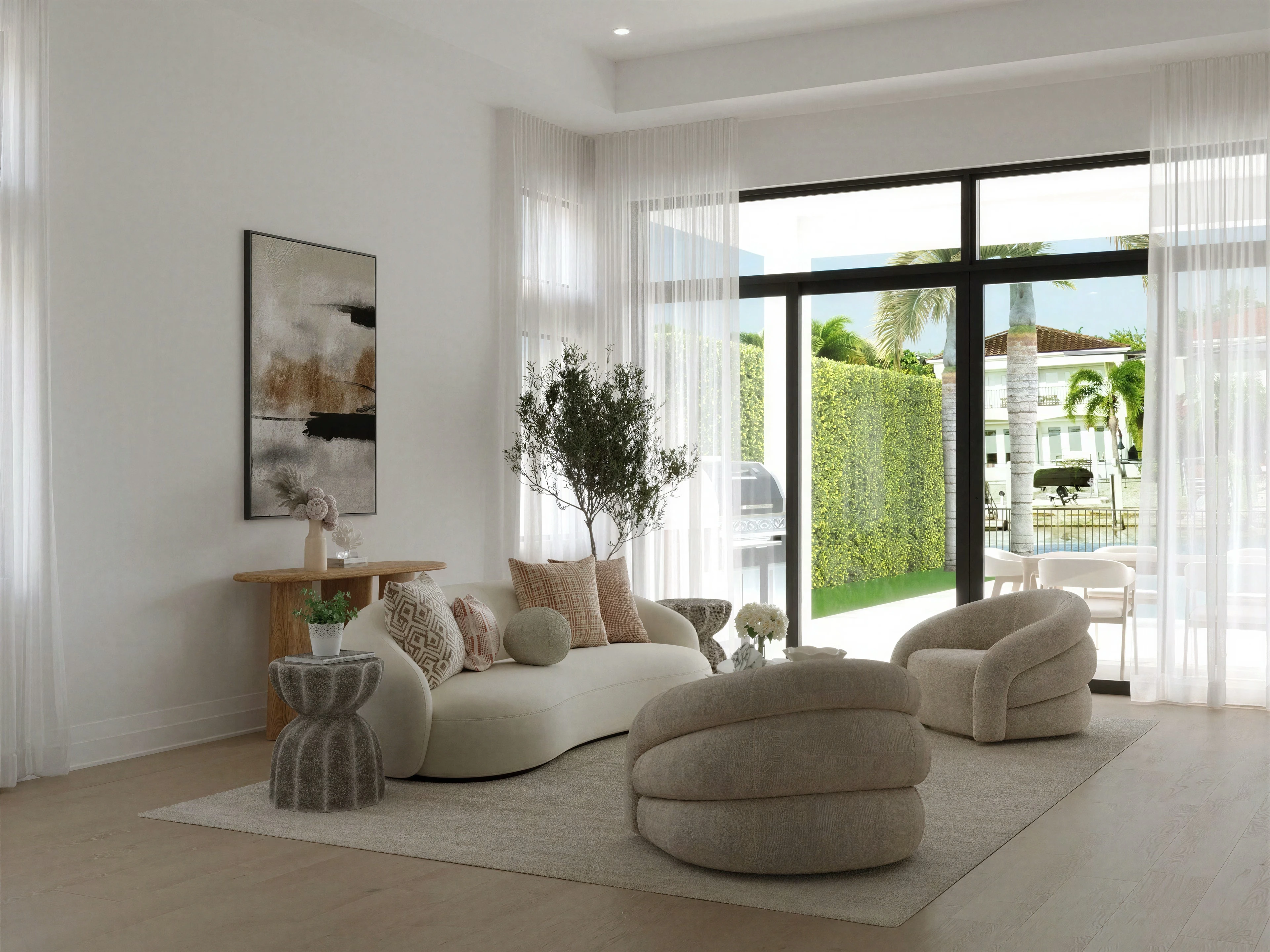 Light-filled sitting area with curved seating and full-height glass doors.
