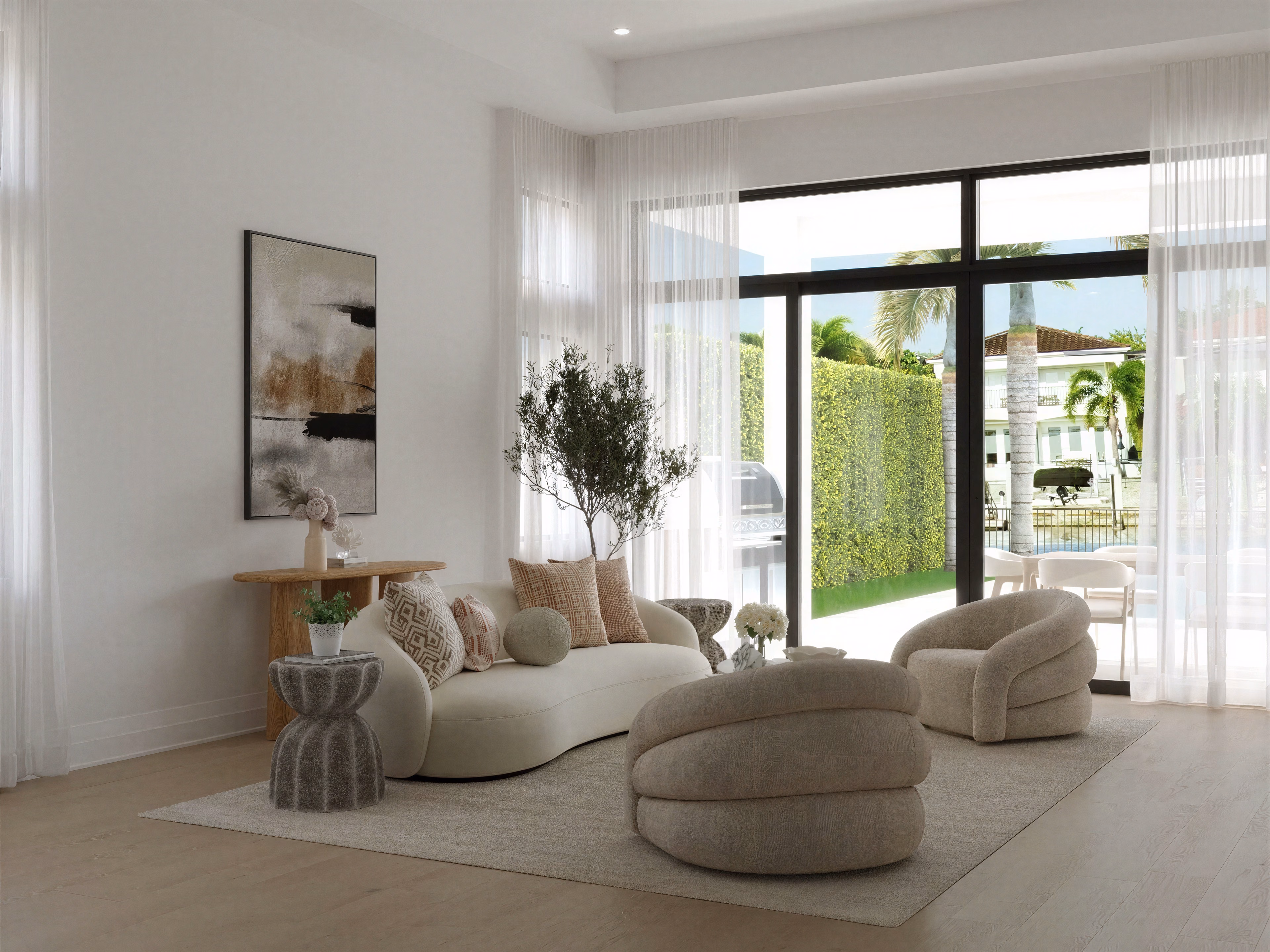 Sabal Palm Drive living room with cream curved seating and floor-to-ceiling windows